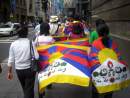 Tibetans and their supporters display Tibetan National Flag